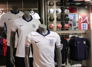 Fanatics and FA renew partnership after Euro 2024 success England football kits in a store.