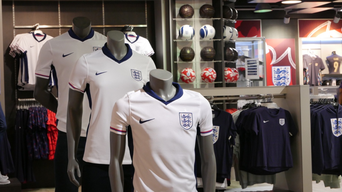 England football kits in a store.