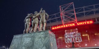 Manchester United extends Konami deal with eFootball rewards Manchester United , Old Trafford Stadium. United Trinity Statue, George Best, Denis Law and Bobby Charlton reaching for the Stars.