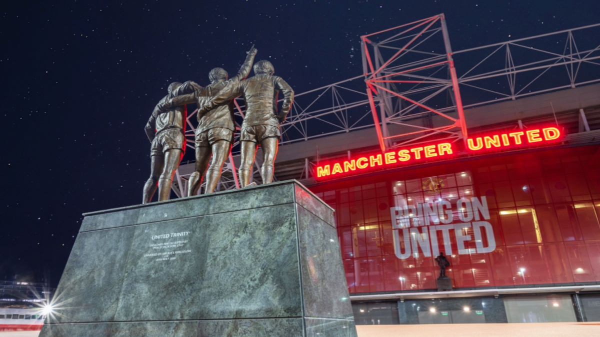Manchester United , Old Trafford Stadium. United Trinity Statue, George Best, Denis Law and Bobby Charlton reaching for the Stars.