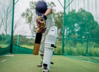 ECB continues on digital transformation path with Cognizant Front view of Cricket Batsman Action, Cricket game closeup player batting ball.