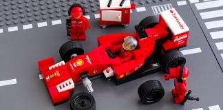 Formula One builds on younger audience surge with LEGO deal Tambov, Russian Federation - June 23, 2015 Lego team crew members fixing wheel of Lego Speed Champions Ferrari F14 T race car. Studio shot.