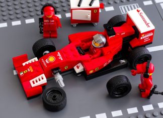Formula One builds on younger audience surge with LEGO deal Tambov, Russian Federation - June 23, 2015 Lego team crew members fixing wheel of Lego Speed Champions Ferrari F14 T race car. Studio shot.
