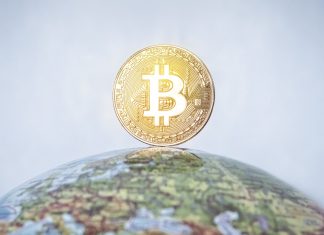 DAZN enters crypto sphere with European partnership BITCOIN tag on the globe. gold bitcoin with gold bitcoin symbol and Earth.