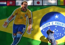 Brazil’s Ministry of Finance signs key integrity agreements Kolkata, India, 20-11-2022 - A painter applies finishing touches to an image of Brazil's national flag with Neymar Júnior, on a wall along a road ahead of the FIFA World Cup, in Kolkata.
