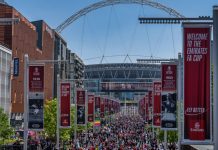 FA plans additional prize money amid replay controversy London, United Kingdom - May 14, 2022: Liverpool won the FA Cup Final against Chelsea, supporters marching towards the stadium before the final.