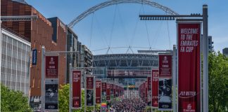 FA plans additional prize money amid replay controversy London, United Kingdom - May 14, 2022: Liverpool won the FA Cup Final against Chelsea, supporters marching towards the stadium before the final.