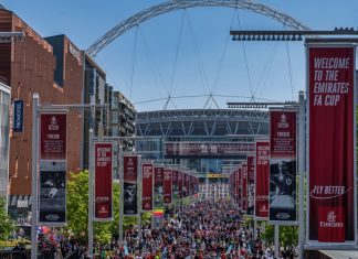 FA plans additional prize money amid replay controversy London, United Kingdom - May 14, 2022: Liverpool won the FA Cup Final against Chelsea, supporters marching towards the stadium before the final.