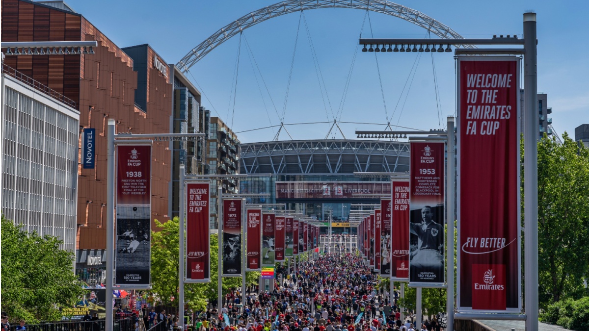 London, United Kingdom - May 14, 2022: Liverpool won the FA Cup Final against Chelsea, supporters marching towards the stadium before the final.