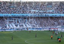 Racing Club’s Roby Martinez Alvarez – Maintaining DNA amid commercial deals Avellaneda, Buenos Aires, Argentina. 12th. January 2012. Reception from the Racing Club public showing its big flag at the Presidente Peron Stadium during the match between Racing Club and Tigre.