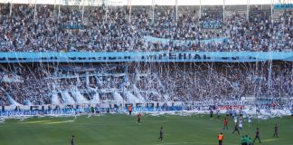Racing Club’s Roby Martinez Alvarez – Maintaining DNA amid commercial deals Avellaneda, Buenos Aires, Argentina. 12th. January 2012. Reception from the Racing Club public showing its big flag at the Presidente Peron Stadium during the match between Racing Club and Tigre.