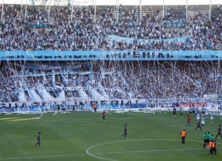 Racing Club’s Roby Martinez Alvarez – Maintaining DNA amid commercial deals Avellaneda, Buenos Aires, Argentina. 12th. January 2012. Reception from the Racing Club public showing its big flag at the Presidente Peron Stadium during the match between Racing Club and Tigre.