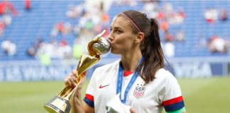FIFA unbundles US Women’s World Cup rights for first time Alex Morgan kisses the world cup after the FIFA Women's World Cup France 2019 Final football match USA vs Netherlands on 7 July 2019 Groupama Stadium Lyon France.