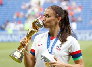 FIFA unbundles US Women’s World Cup rights for first time Alex Morgan kisses the world cup after the FIFA Women's World Cup France 2019 Final football match USA vs Netherlands on 7 July 2019 Groupama Stadium Lyon France.
