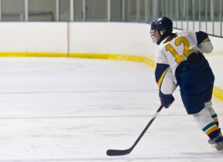 PWHL fans gain access to streaming via FanDuel app Female Ice hockey player during a game in an arena.