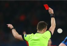 Argentine lawmaker targets referee corruption in football DECEMBER 11, 2019 - KHARKIV, UKRAINE: Champions League. FC Shakhtar Donetsk-Atalanta BC. Main referee shows red card. Close-up view from the back.