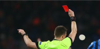 Argentine lawmaker targets referee corruption in football DECEMBER 11, 2019 - KHARKIV, UKRAINE: Champions League. FC Shakhtar Donetsk-Atalanta BC. Main referee shows red card. Close-up view from the back.