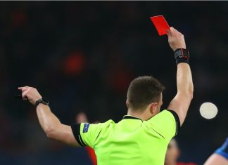 Argentine lawmaker targets referee corruption in football DECEMBER 11, 2019 - KHARKIV, UKRAINE: Champions League. FC Shakhtar Donetsk-Atalanta BC. Main referee shows red card. Close-up view from the back.