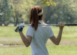 KPMG applauds women’s golf resurgence with sponsorship renewal Women's golf Using golf clubs To help twist To warm up body before the play game with blurred soft nature background.