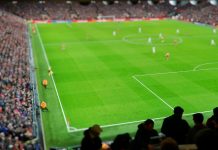 FDC and Stats Perform to redefine storytelling in UK football Blurred background of football players playing and soccer fans in match day on beautiful green field with sport light at the stadium. Sports,Athlete,People Concept.Anfield,Mercyside,Liverpool,UK.