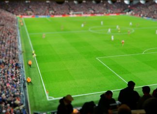 FDC and Stats Perform to redefine storytelling in UK football Blurred background of football players playing and soccer fans in match day on beautiful green field with sport light at the stadium. Sports,Athlete,People Concept.Anfield,Mercyside,Liverpool,UK.