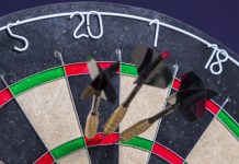 Darts limits women’s events to biological sex after UK ruling Darts scoring one hundred and eighty on a board.