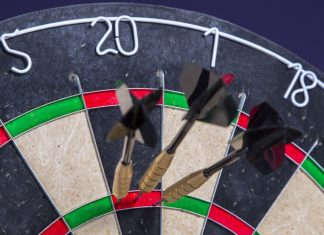 Darts limits women’s events to biological sex after UK ruling Darts scoring one hundred and eighty on a board.