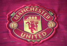 Manchester United signs record £20m Betway kit deal Warrington cheshire UK - may 21 2024: Manchester united logo on t-shirt.