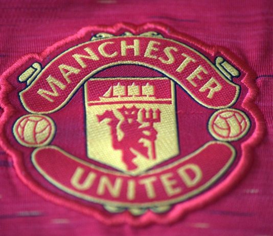 Manchester United signs record £20m Betway kit deal Warrington cheshire UK - may 21 2024: Manchester united logo on t-shirt.