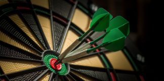 PDC World Darts Championship boosts commercial success in 2024/25 Darts board with three darts in the bullseye.