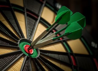 PDC World Darts Championship boosts commercial success in 2024/25 Darts board with three darts in the bullseye.