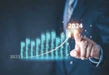 Better Collective overcomes ‘unforeseen challenges’ for strong 2024 results Column chart with company progress and growth by year, 2024, businessman calculates financial data for long term investments.