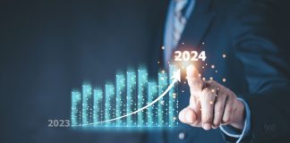Better Collective overcomes ‘unforeseen challenges’ for strong 2024 results Column chart with company progress and growth by year, 2024, businessman calculates financial data for long term investments.