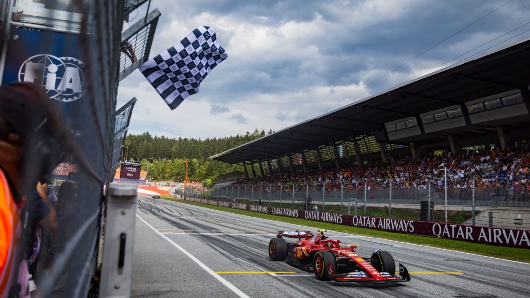 Red Bull Ring, Spielberg, Austria. 30.June.2024; Carlos Sainz Jr of Spain and Scuderia Ferrari receives checker flag during F1 Austrian Grand Prix.