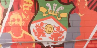 Wrexham AFC eyes international matches with new Kop stand Wrexham, Wales - 9th November 2024: A mural on a brick wall inside the Racecourse Ground, home stadium of Wrexham AFC in Wrexham, Wales, UK.