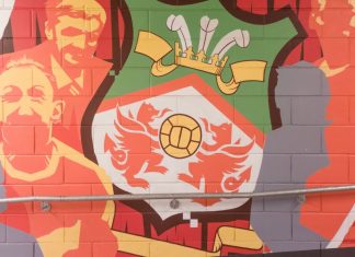 Wrexham AFC eyes international matches with new Kop stand Wrexham, Wales - 9th November 2024: A mural on a brick wall inside the Racecourse Ground, home stadium of Wrexham AFC in Wrexham, Wales, UK.