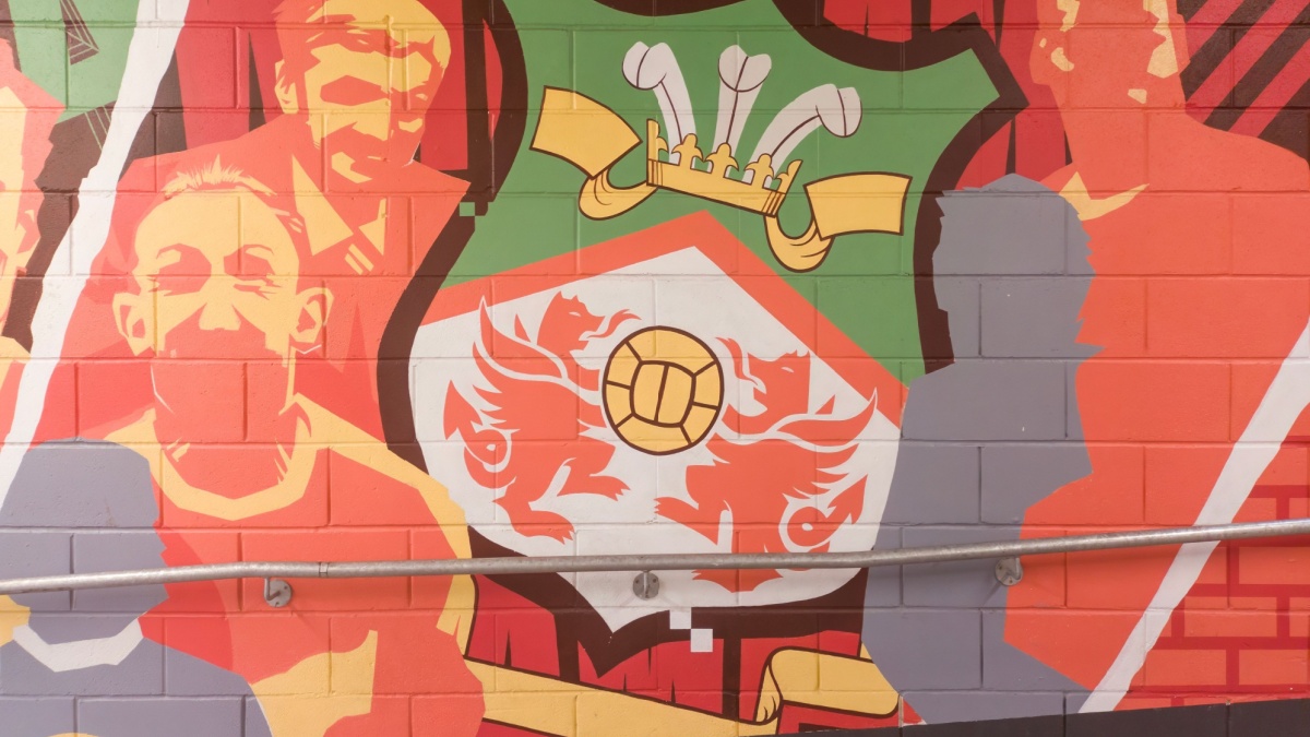 Wrexham, Wales - 9th November 2024: A mural on a brick wall inside the Racecourse Ground, home stadium of Wrexham AFC in Wrexham, Wales, UK.