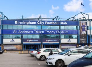 Tom Brady’s Birmingham City partner caught in licensing scandal BIRMINGHAM, ENGLAND - SEPTEMBER 17, 2019: Parked cars outside St Andrews Trillion Trophy Stadium in Birmingham, England.
