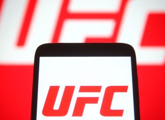 UFC’s Tom Aspinall to feature in casino marketing campaign with SPRIBE KYIV, UKRAINE - SEPTEMBER 29, 2021: In this photo illustration Ultimate Fighting Championship (UFC) logo is seen on a mobile phone and a computer screen.