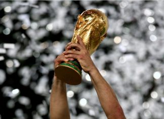Football fans warned: 2026 World Cup a “prime target” for fraudsters Berlin, GERMANY - July 09, 2006: The FIFA World Cup trophy is raised during the 2006 FIFA World Cup Germany Final Italy v France at the Olympiastadion.