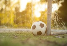 Brazil’s CBF and Sportradar tighten the net on match manipulation Football in front of a net at sunset.