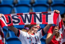 ‘They didn’t try to win’: Fan sues USWNT for $100m PARIS, FRANCE - 16 JUNE, 2019: A fan holds USWNT scarf before the 2019 FIFA Women's World Cup match between USA and Chile.