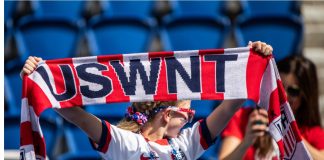 ‘They didn’t try to win’: Fan sues USWNT for $100m PARIS, FRANCE - 16 JUNE, 2019: A fan holds USWNT scarf before the 2019 FIFA Women's World Cup match between USA and Chile.