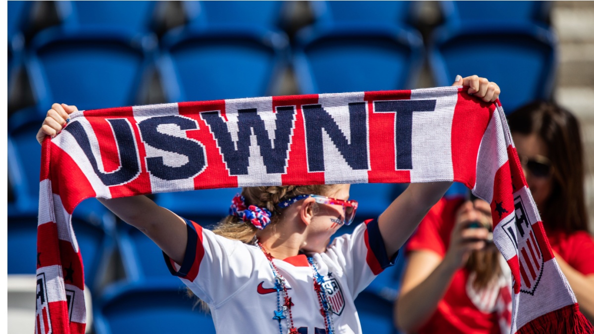 PARIS, FRANCE - 16 JUNE, 2019: A fan holds USWNT scarf before the 2019 FIFA Women's World Cup match between USA and Chile.