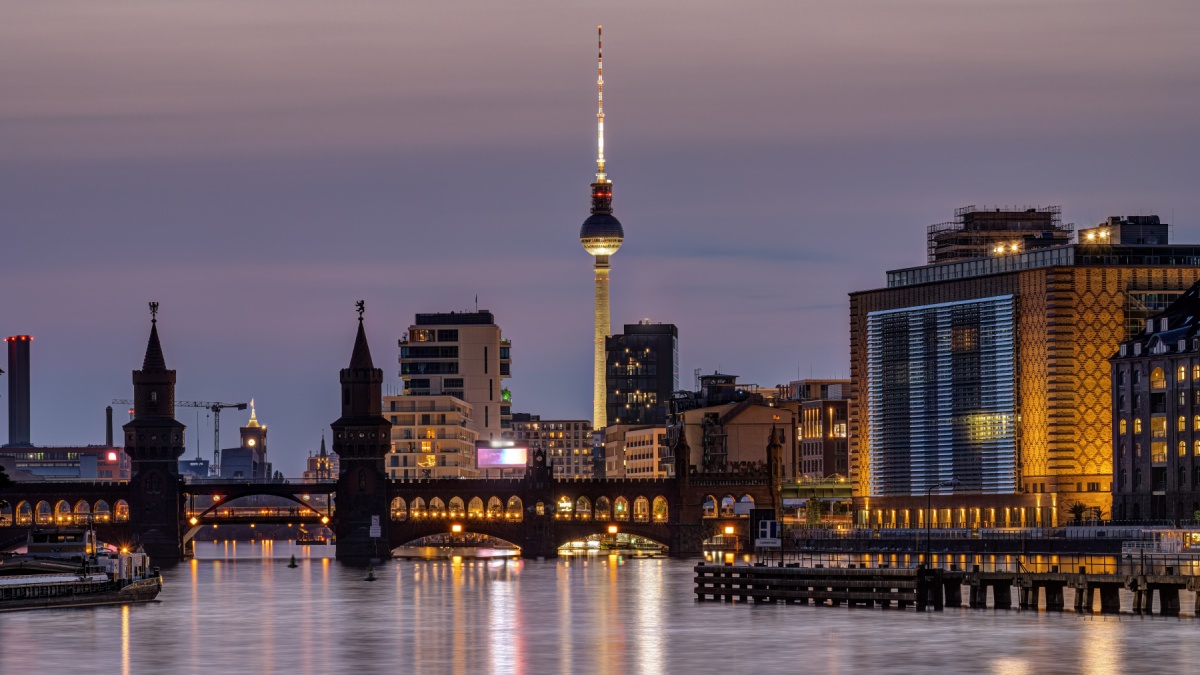 Berlin with the river Spree at dusk with the Oberbaum Bridge and the famous Television Tower.