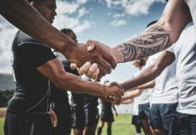 TNT Sports backs Premiership Rugby’s growth with new rights deal Athlete, rugby and handshake with men on field for stadium, sportsmanship and premiership league. Tradition, respect and competition with people in club for tournament, games ceremony and teamwork.