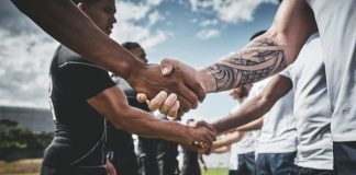 TNT Sports backs Premiership Rugby’s growth with new rights deal Athlete, rugby and handshake with men on field for stadium, sportsmanship and premiership league. Tradition, respect and competition with people in club for tournament, games ceremony and teamwork.