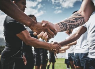 TNT Sports backs Premiership Rugby’s growth with new rights deal Athlete, rugby and handshake with men on field for stadium, sportsmanship and premiership league. Tradition, respect and competition with people in club for tournament, games ceremony and teamwork.