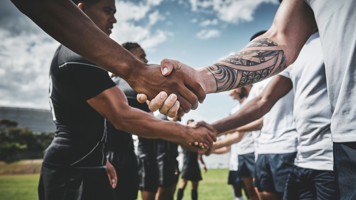 Athlete, rugby and handshake with men on field for stadium, sportsmanship and premiership league. Tradition, respect and competition with people in club for tournament, games ceremony and teamwork.