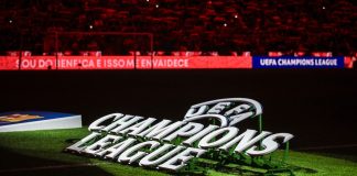 Football reigns as king of crypto investment, but for how long? UEFA Champions League logo on pitch.